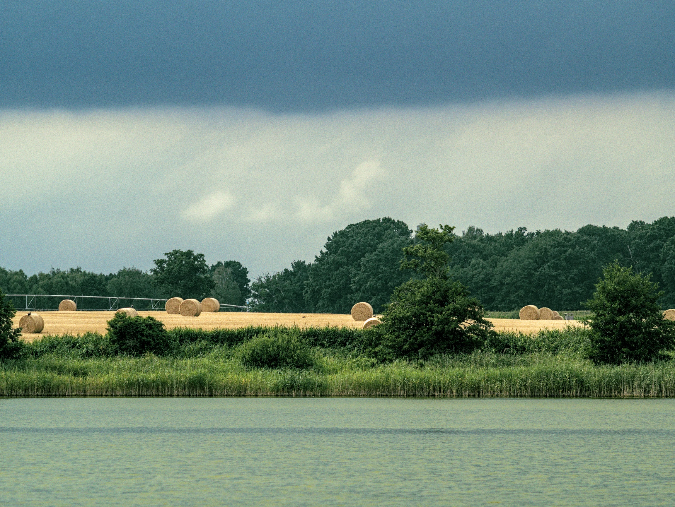 a rural landscape seen from a lake